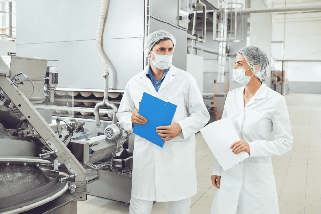 Man and woman in a meat processing plant
